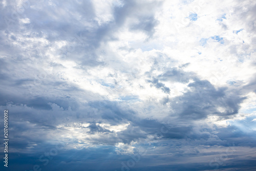Blue Overcast Sky with Layered Clouds before Rain. Blue overcast sky filled with layered clouds before rainfall. Natural weather background suitable for climate, seasonal, environmental