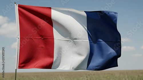 French Flag Waving Proudly Against a Clear Blue Sky.