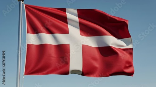 Danish Flag Waving Proudly Against a Clear Blue Sky.