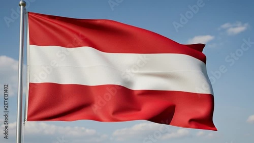 Austrian National Flag Waving in the Wind Against a Clear Blue Sky.