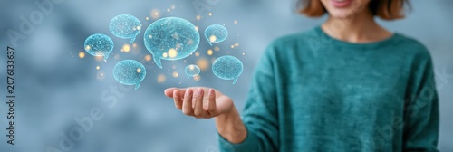 Holographic speech bubbles and network icons above an open hand with a woman in the background for ai communication and futuristic technology background
