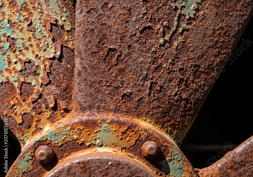 Rusty metal gear close-up with oxidized surface
