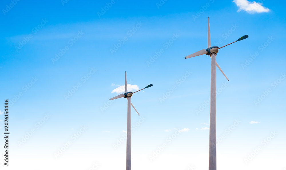 Fototapeta premium Wind mill power energy farm generator renewable sustainable field on blue sky, environment eco system technology industry ecology electricity power propeller turbine clean carbon.