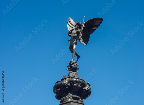 Eros statue in Piccadilly Circus London
Eros statue on the Shaftesbury Memorial Fountain in Piccadilly Circus, London, photographed against a clear blue sky with copy space.