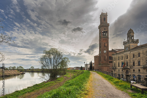 view of the village of Cavarzere from the bank of the Adige river, Venice, Italy