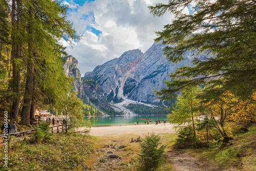 Scenic view of Lago di Braies surrounded by Dolomite mountains, Italy