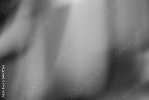 Abstract blurred background with soft monochrome gradients. Black and white out-of-focus bokeh texture with elegant smooth shadows.