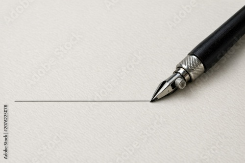 A pen sits atop a piece of paper, ready for writing or note-taking
