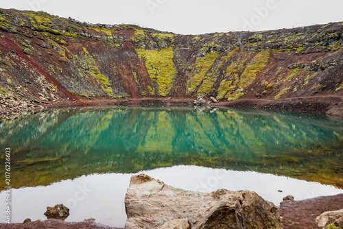 Quadro su tela Kerið Volcanic crater lake with red lava walls, Iceland