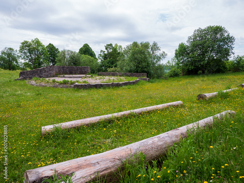 Canvastavla Open-air stone stage surrounded by wildflower meadow and trees in a peaceful park near Kremnické Bane, Slovakia, a scenic outdoor venue for cultural events and performances