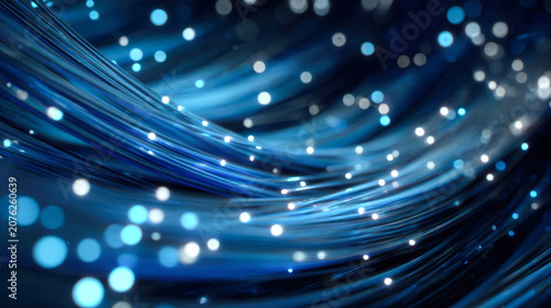 Close-up view of optical fiber bundle with blue strands and white light on dark blue background