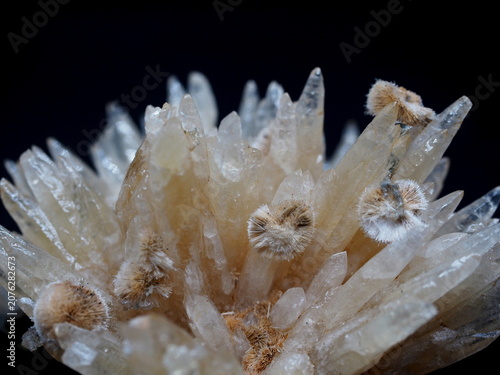 Photography A close-up of sharp calcite crystals accented by fuzzy zeolites.