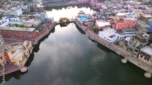 A drone takes off vertically over the sacred lakes of Radha Kunda and Shyama Kunda in Govardhana, Vrindavan