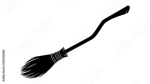 Fényképezés Witch's Broom Silhouette: A stylized black silhouette of a witch's broom, its bristles fanned out and handle curved, poised for flight against a stark backdrop