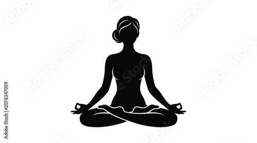 A woman performs lotus yoga pose in serene environment indoors.