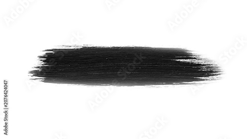 Brush stroke of black paint creates a singular, bold mark on a clean white background that is suitable for use as a minimalist graphic element in various creative design layouts.