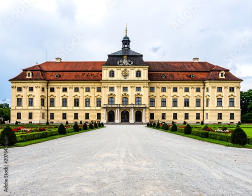 Historic neoclassical palace with central dome and gardens.