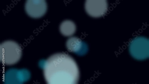 Abstract Bokeh Lights: A dark, atmospheric background featuring a cluster of soft, out-of-focus bokeh lights in shades of blue and white, creating a dreamy and ethereal effect.