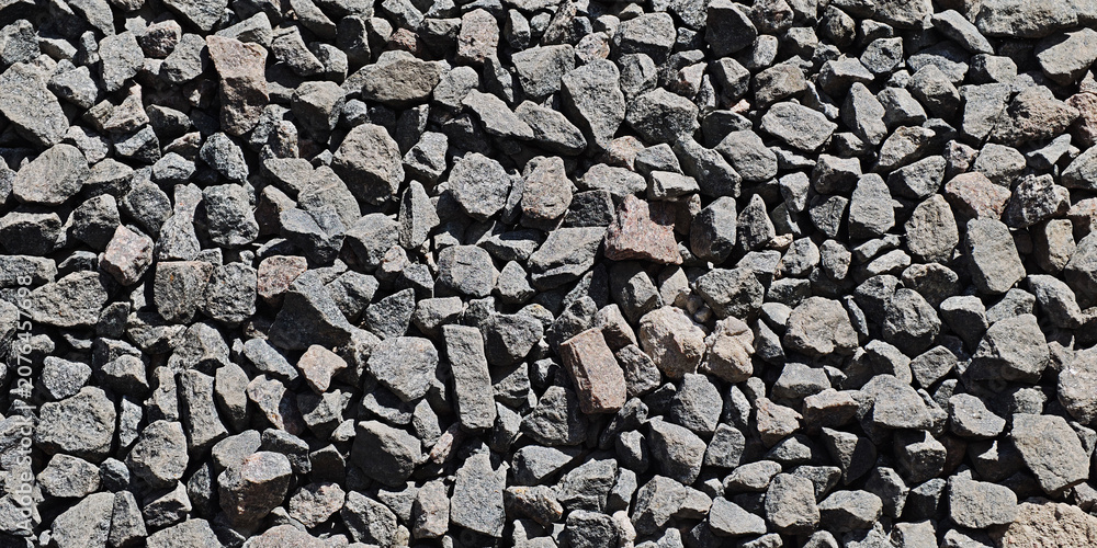 Фотография Crushed stone creating a textured surface, ideal for backgrounds, construction,