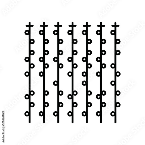 Black metal fence with circles.