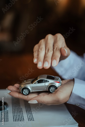 Auto Insurance Protection with Toy Car, Contract and Car Key