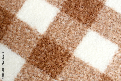 Texture of checkered wool fabric with pile.
