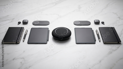 Professional set of sleek black electronic devices and stationery for productivity on white marble surface