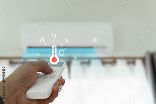Fotografi A thermometer that measures the temperature of an air conditioner inside a room