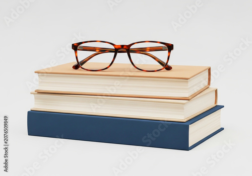 Colorful glasses resting on top of two stacked books