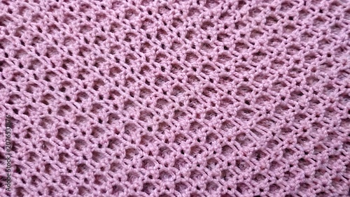 Cuadro en lienzo Pink knitted fabric texture with openwork mesh stitch pattern