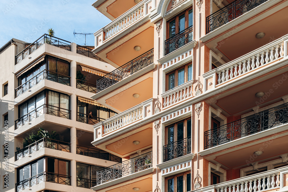 Obraz premium Monaco, Monaco - June 6, 2026: Contrasting residential apartment buildings showcase contemporary and Belle Époque architecture during Monaco Grand Prix qualifying weekend