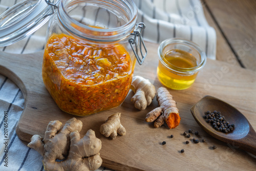 Probiotic healthy ferment with ginger, turmeric, and honey - a home remedy from traditional cuisine