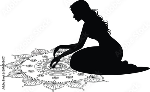 Woman sitting on floor creating intricate circular mandala design with hands