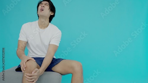 male athlete or spot male having knee injury due to ligament inflammation, man knee pain due to exercise, massage, muscle relaxation, rheumatoid arthritis, gait disturbance, rheumatoid arthritis
