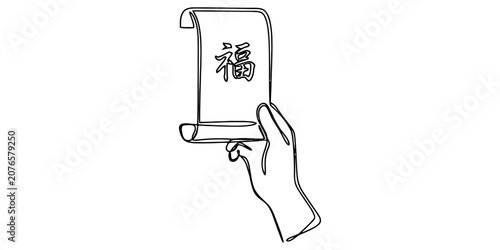 фотографія A hand holding a traditional chinese scroll with the lucky fu character written