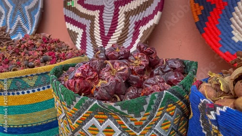 Close up overview across lots of vibrant colorful herb and spice powders in street market. Different spices displayed for sell.