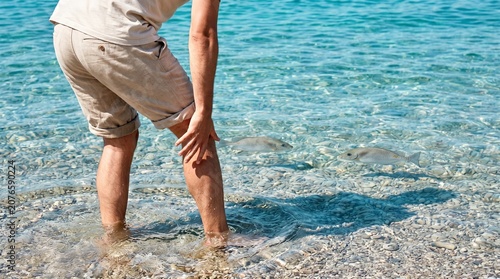 Mediterranean Shoreline Foot Sting Reaction With lagocephalus sceleratus Nearby