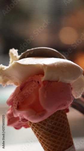 Supermarket ice cream shelf with various flavors and brands, retail food concept.