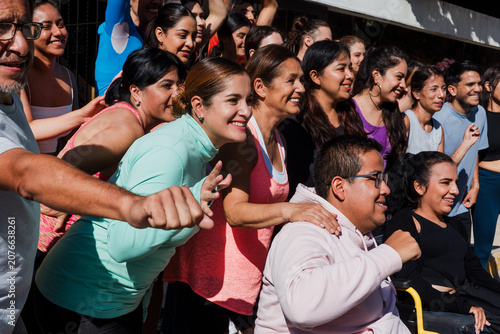 Diverse Group of latin american athletic people and Smiling young Adults in Athletic Wear in Mexico Latin America, hispanic people in wheelchair in social inclusion in sport activity 