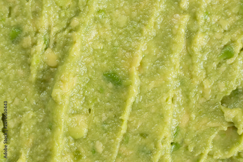 Obraz premium Abstract food background of fresh mashed avocado texture