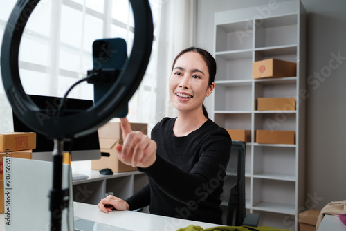 Asian woman live streaming selling products online