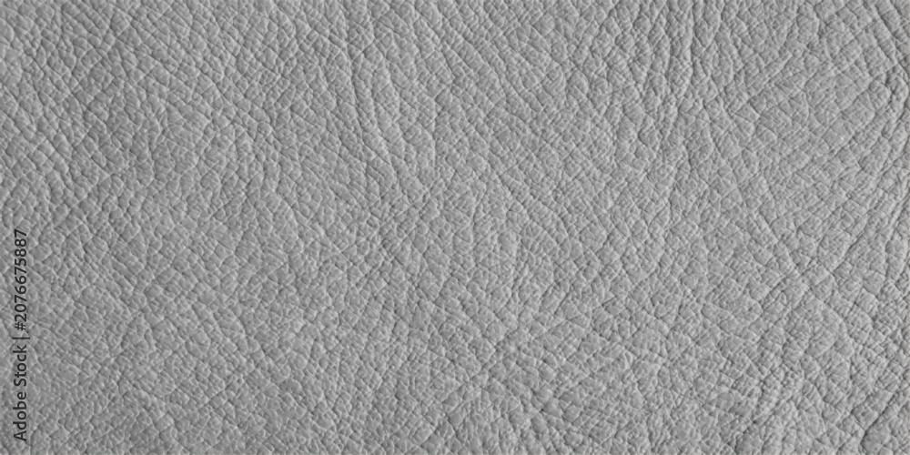 Fototapeta premium A close-up, seamless texture of soft grey leather with a natural, wrinkled grain, showcasing its subtle variations and supple quality.