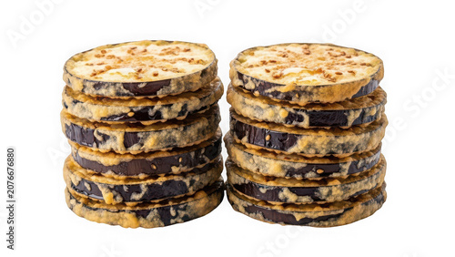Two stacks of fried eggplant slices isolated on transparent background