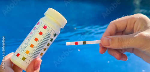 Photography Self-measurement of the water parameters in the pool using test strips