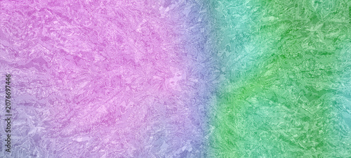 Abstract textured background with a vibrant color gradient shifting from pink and purple to bright green. Perfect for modern artistic backdrops, banners, or creative designs.