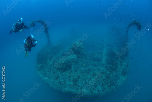 Canvas Print Scuba divers explore the varese wreck site in the waters near pula city, croatia