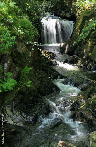 Landscape vertical photo overlooking Ceunant Mawr waterfall in Snowdonia National Park in the UK