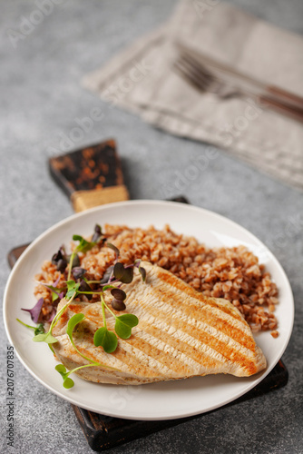 Steak turkey grill, buckwheat  and microgreens in a plate . Diet nutrition