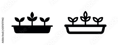 Foto Seedlings in a planter box icon, depicting growth, gardening, and organic agriculture