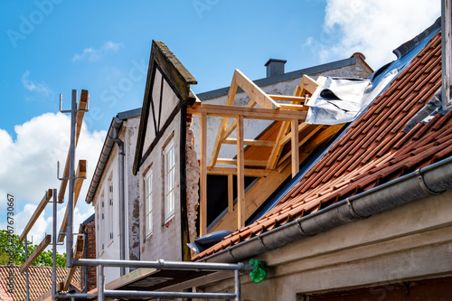 Restoration of a listed gable house with traditional timber construction.